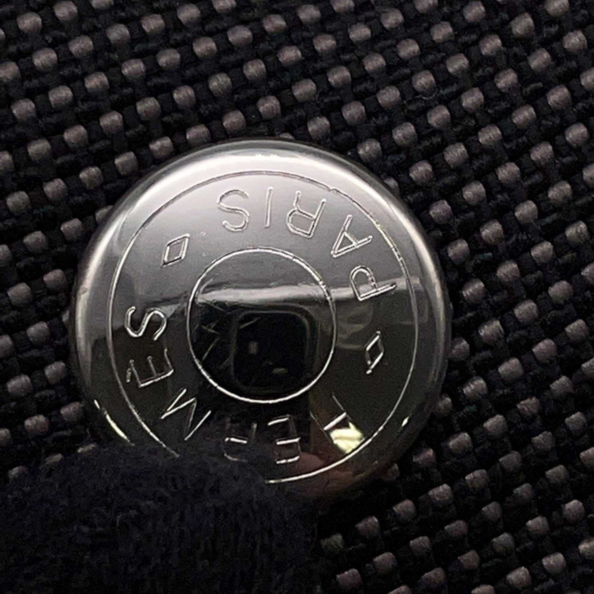 Hermès Pre-Loved Air Line PM Tote Bag featuring a signature circular logo detail on a textured fabric