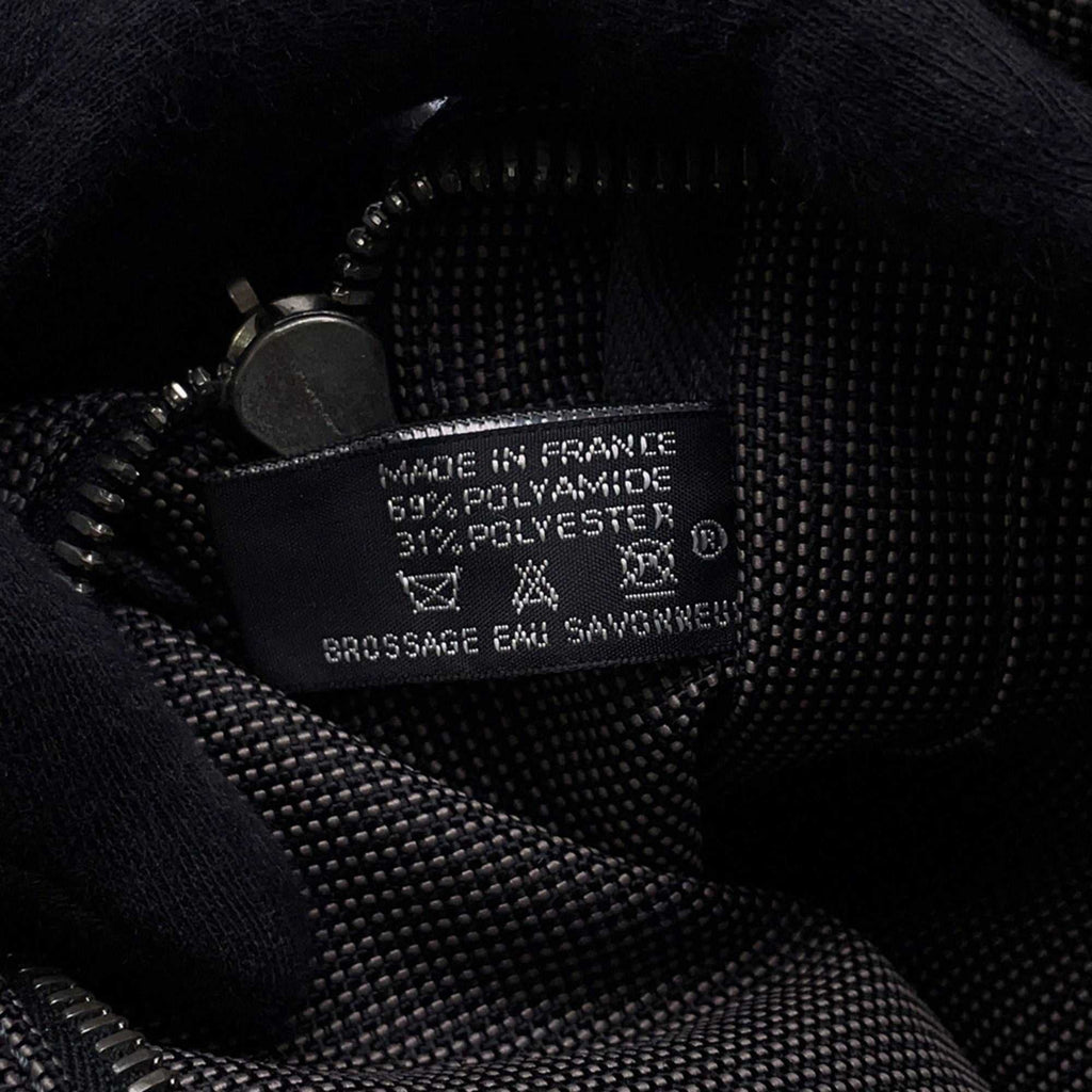 Interior of Hermès Pre-Loved Air Line PM Tote Bag with fabric label and zipper detail