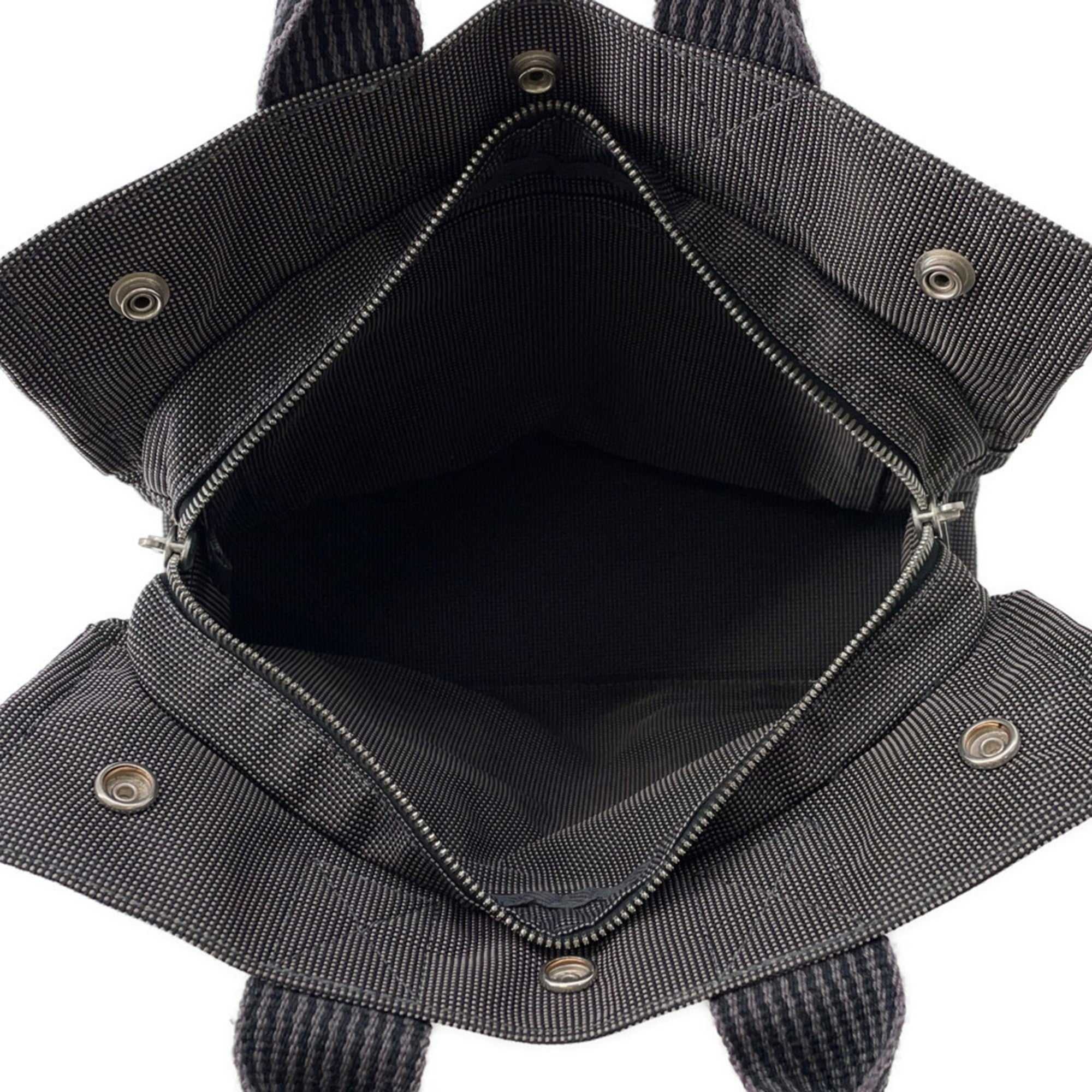 Interior of Hermès Pre-Loved Air Line PM Tote Bag featuring zip pockets and spacious compartment