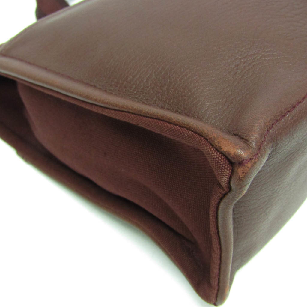 HERMÈS Pre-Loved Fourre Tout MM tote bag in rich brown with durable fabric and leather accents