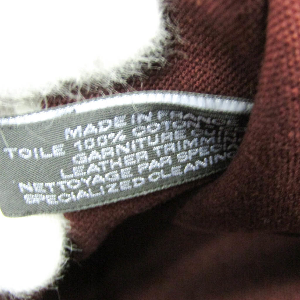 Close-up of the interior label of HERMÈS Pre-Loved Fourre Tout MM tote bag showing care instructions