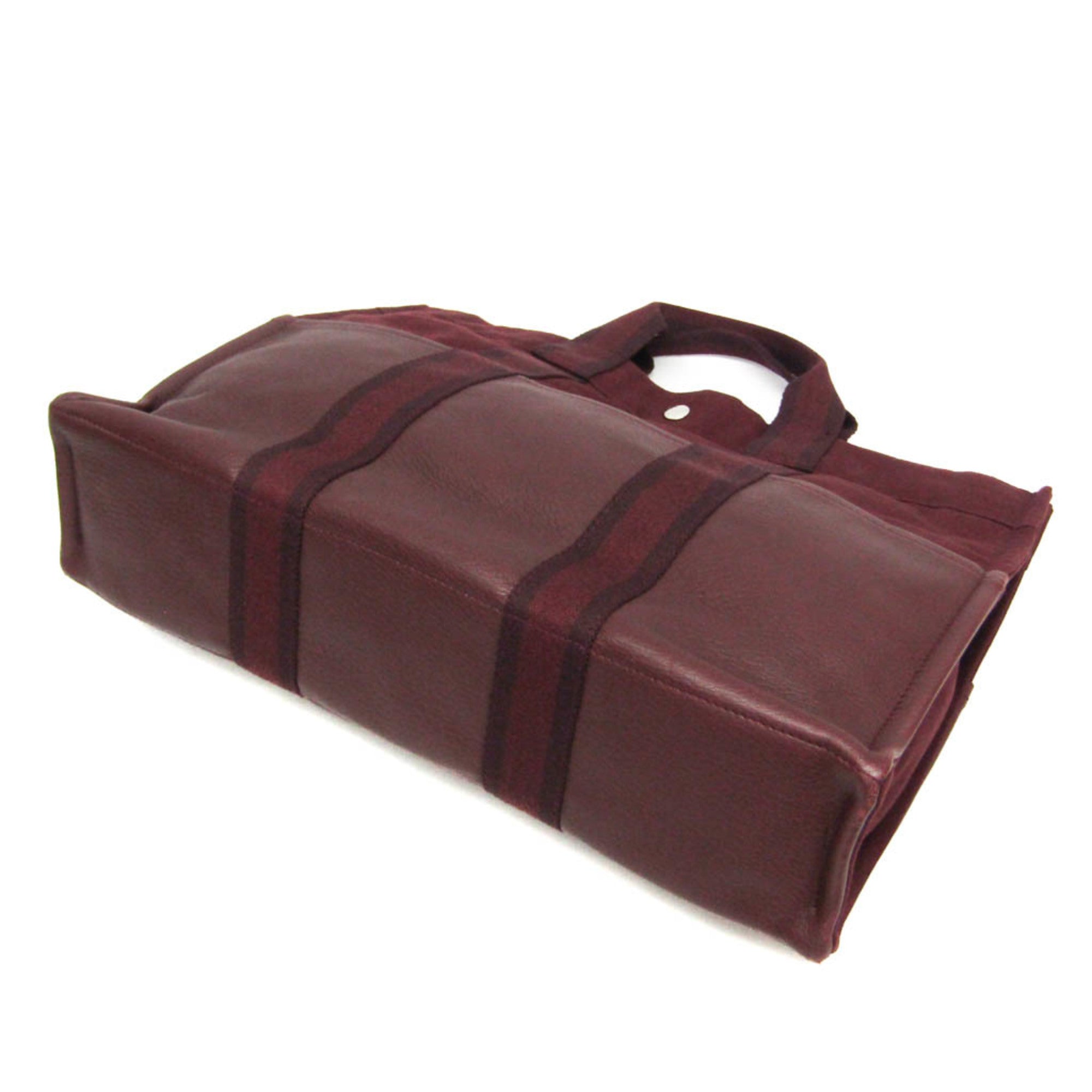 HERMÈS Pre-Loved Fourre Tout MM tote bag in burgundy leather with sturdy handles and spacious design