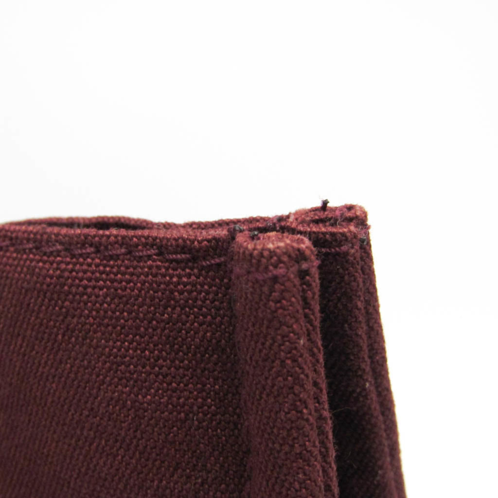 HERMÈS Pre-Loved Fourre Tout MM tote bag with rich burgundy fabric and sturdy handles for everyday use