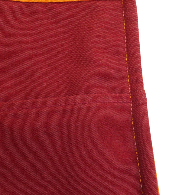 HERMES pre-owned red bag with contrasting yellow stitching and practical pocket detail
