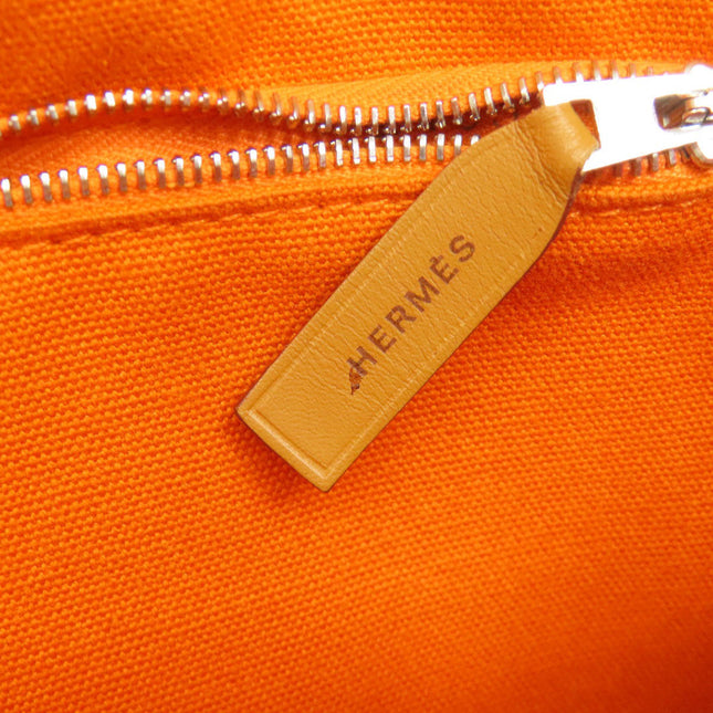 HERMES pre-owned bag in vibrant orange with zipper detail and signature tag