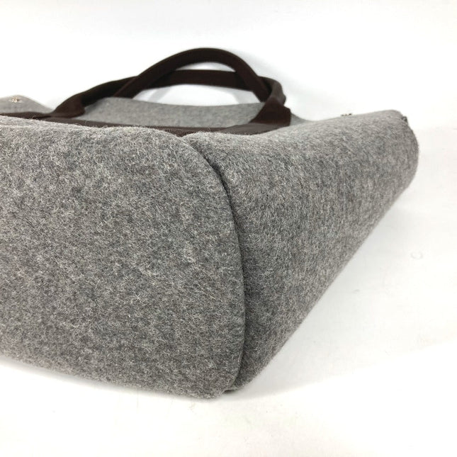 HERMES pre-owned grey felt bag with brown leather handles, ideal for stylish everyday use