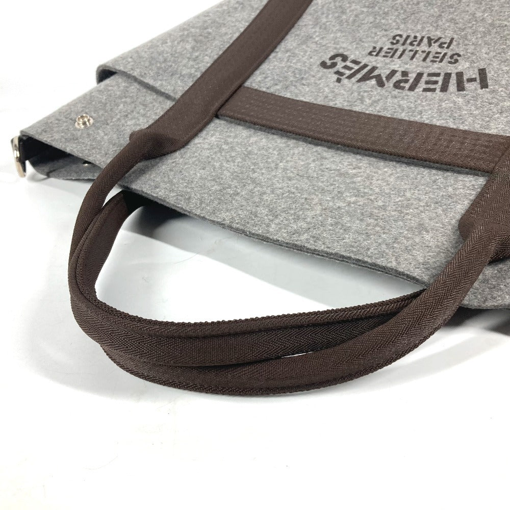 HERMES pre-owned gray felt tote bag with sturdy brown straps and logo print