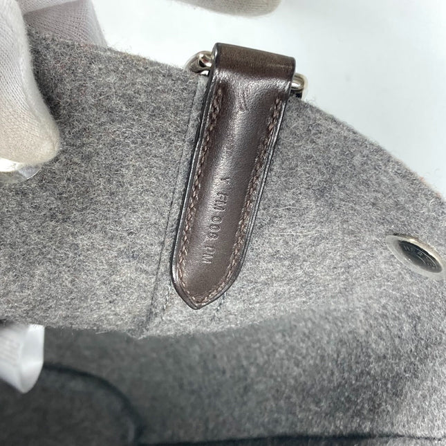 HERMES pre-owned bag interior detail with leather tag and gray felt lining