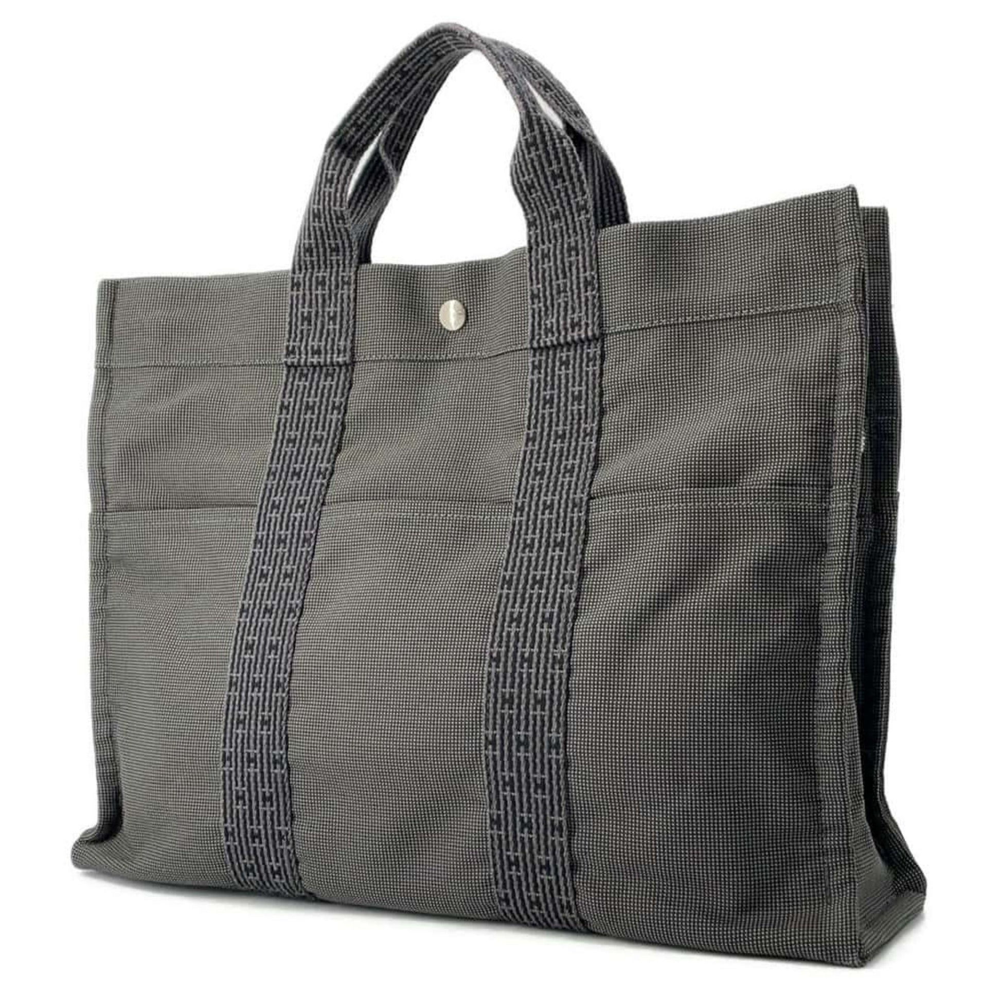 Hermes pre-owned canvas tote bag with double handles and exterior pockets