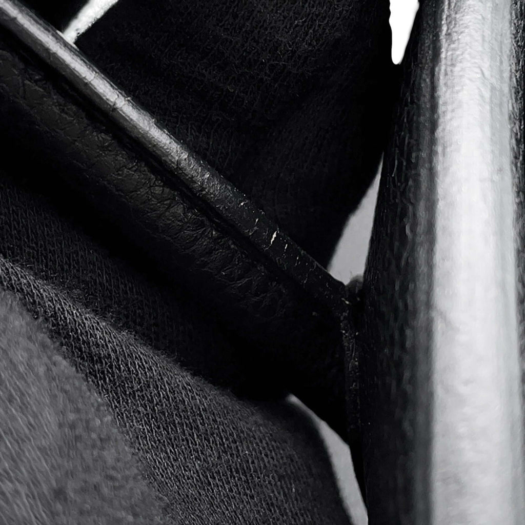 Close-up view of a pre-owned Hermès Birkin 30 showcasing fine leather detailing and hardware