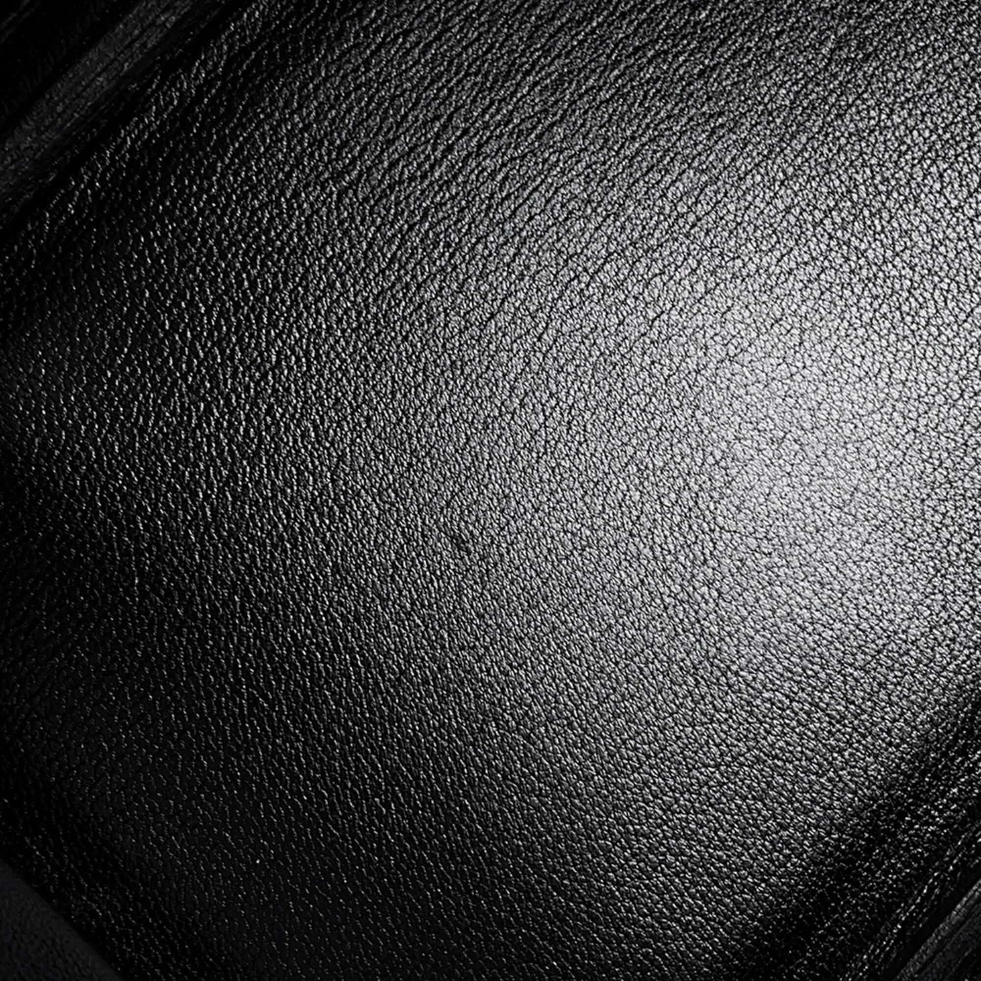 Close-up of the luxurious leather texture of a pre-owned Hermès Birkin 30 handbag
