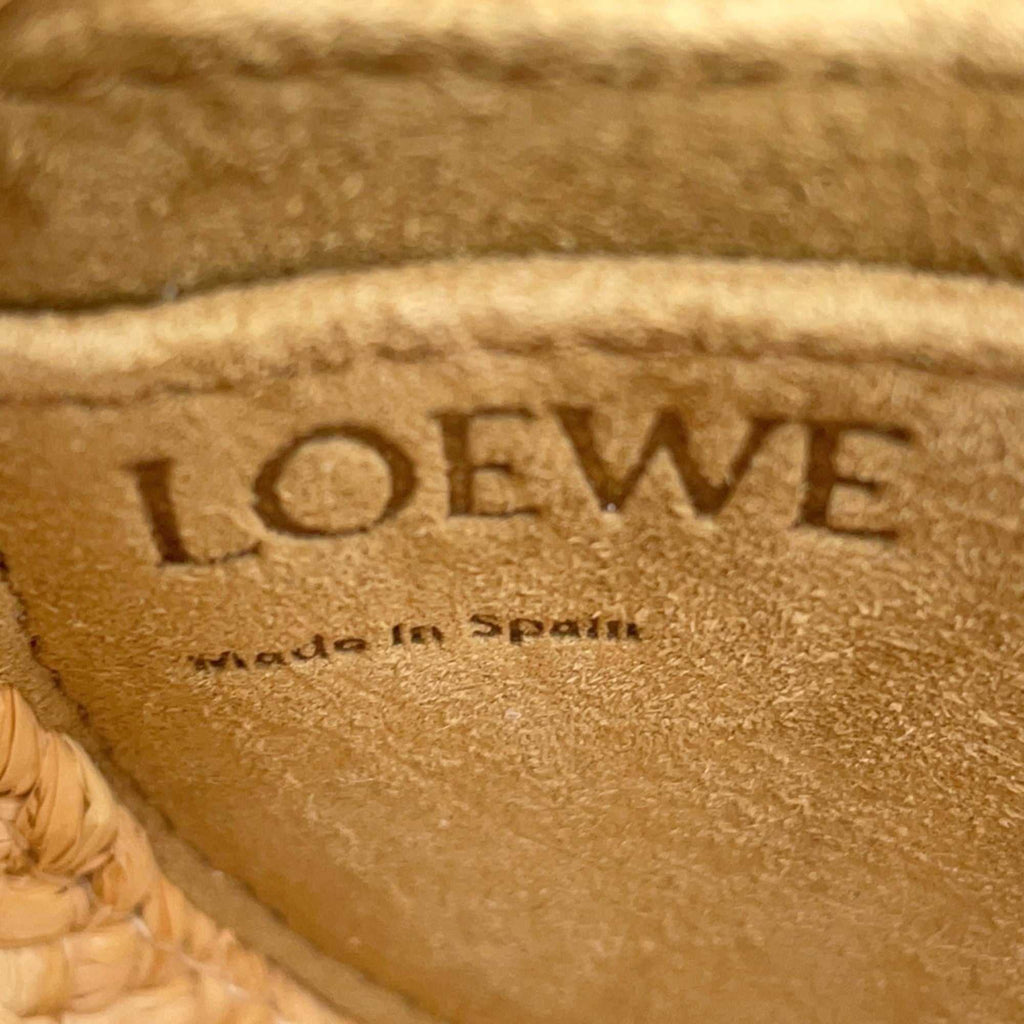 Inside label of LOEWE Pre-Loved Gate Mini Raffia Bag showing Made in Spain craftsmanship