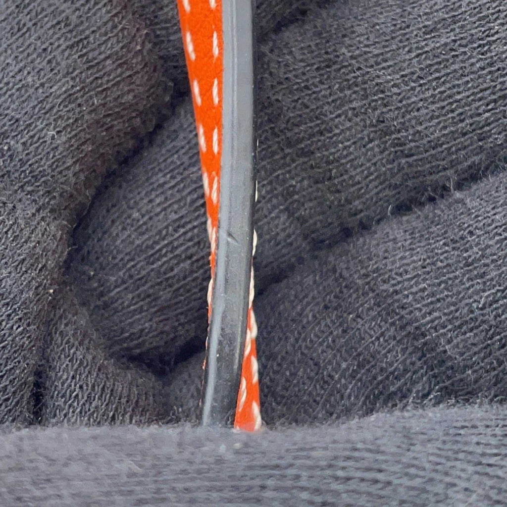 Close-up of the strap of a MANSII LOEWE Pre-Loved Gate Mini Raffia Bag with intricate detailing