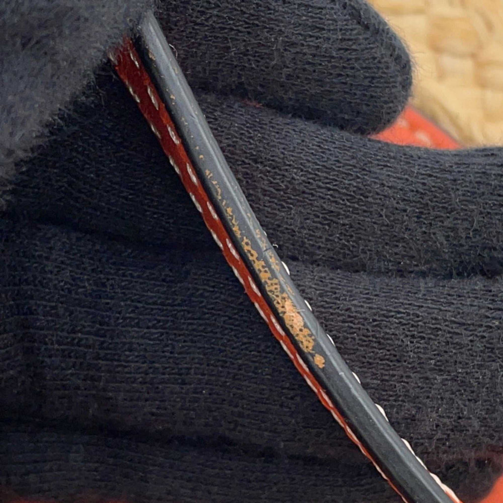 Detail shot of the MANSII LOEWE Pre-Loved Gate Mini Raffia Bag with intricate stitching and textures