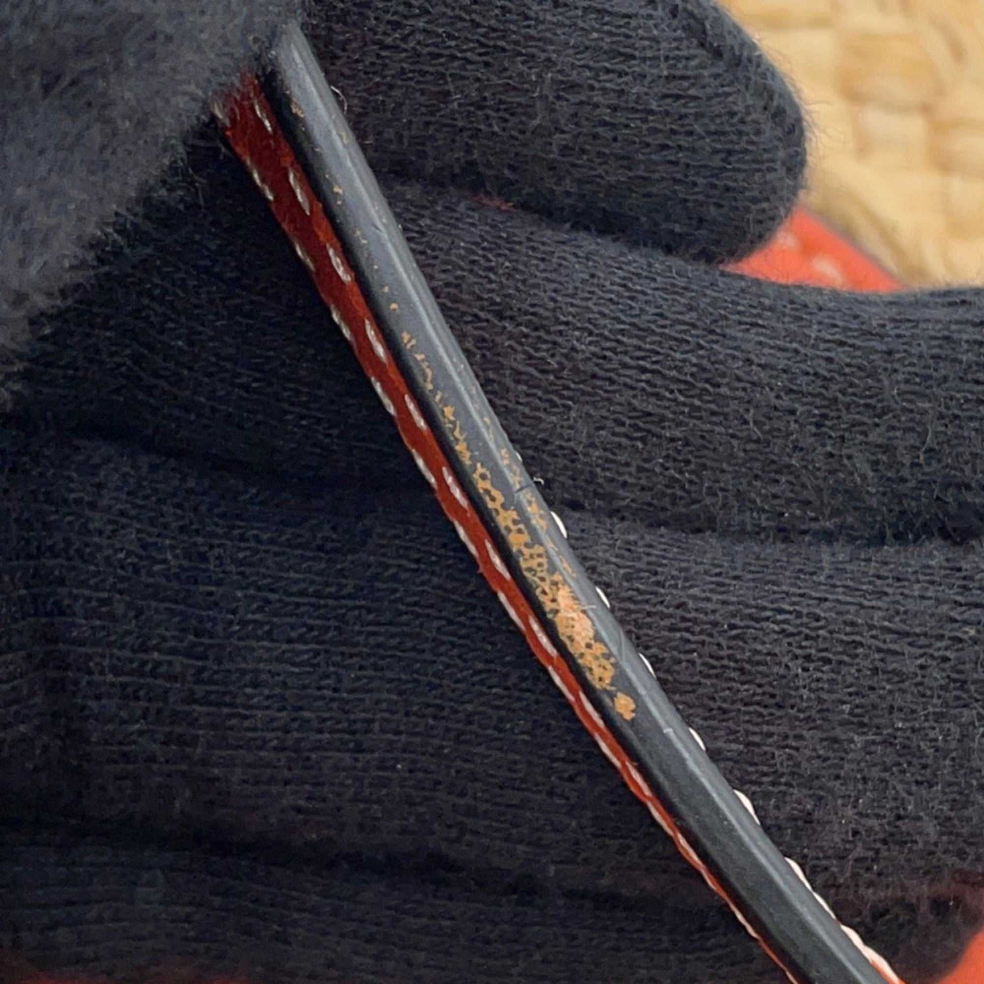 Detail shot of the MANSII LOEWE Pre-Loved Gate Mini Raffia Bag with intricate stitching and textures