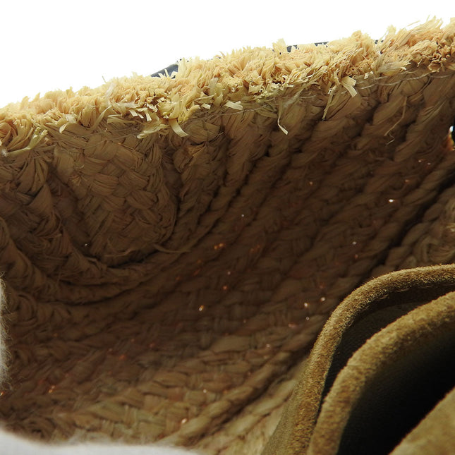 Inside view of a LOEWE pre-owned bag showcasing natural woven texture and intricate details