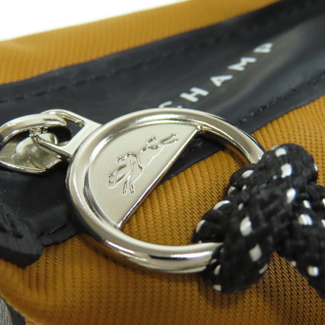 Longchamp pre-owned bag showcasing a stylish zip closure and quality materials