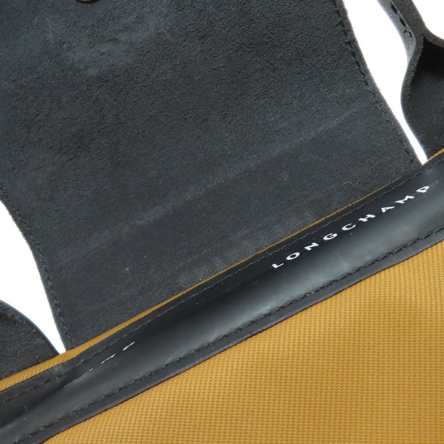 Pre-owned Longchamp bag interior in brown and black with soft lining and logo detail