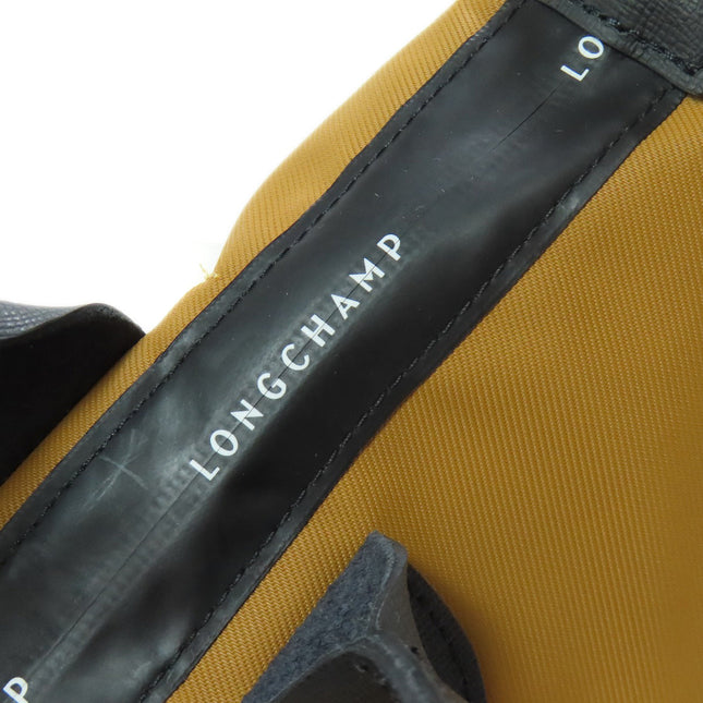 Longchamp pre-owned bag featuring a durable yellow exterior and iconic logo detailing