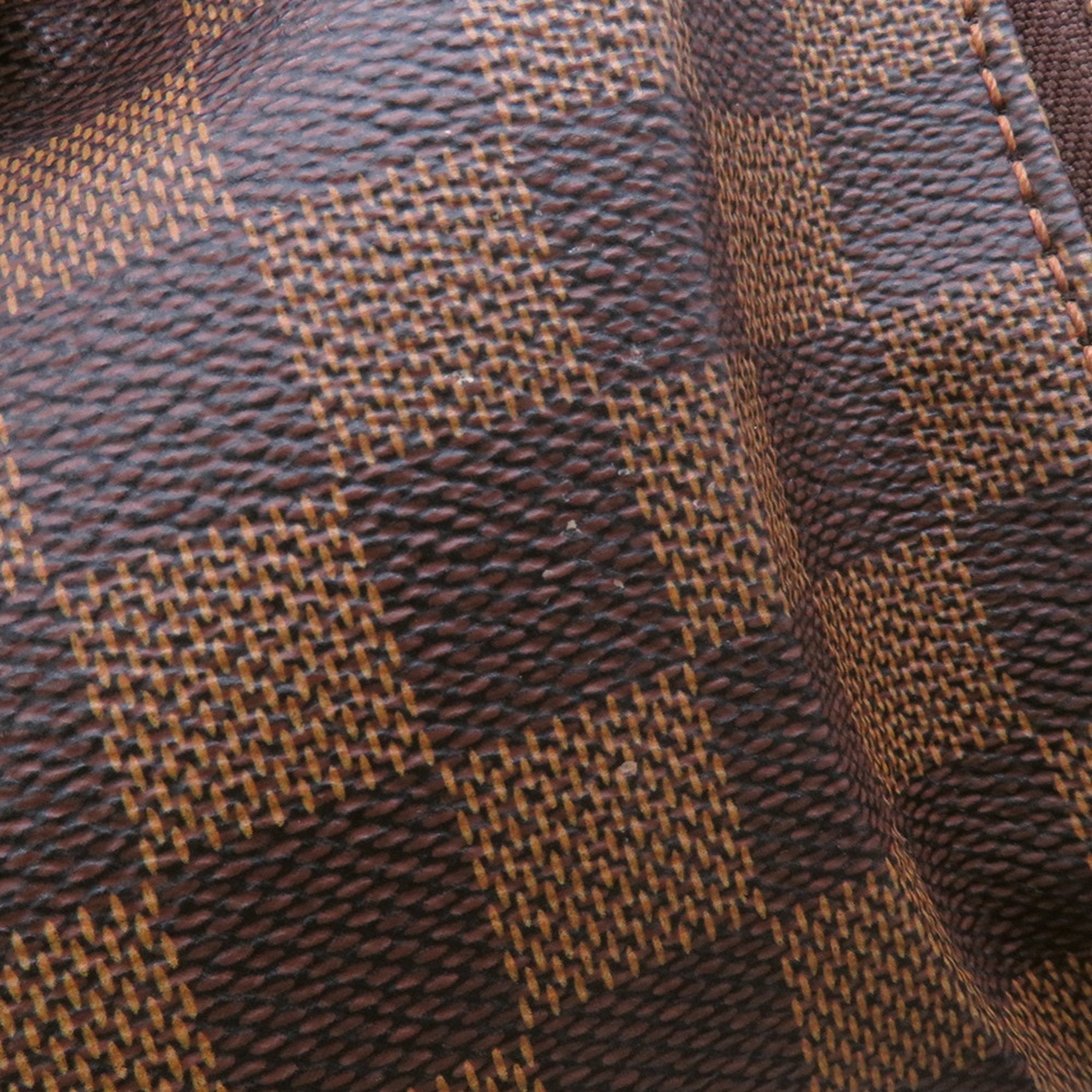 Detailed close-up of the authentic Louis Vuitton Belem MM bag for sale featuring its signature monogram canvas texture
