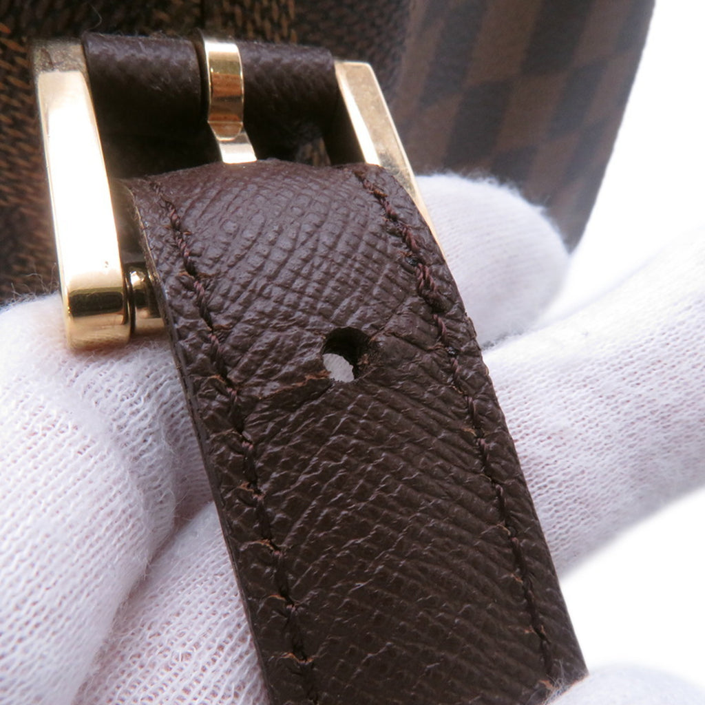 Close-up of the strap detail showcasing the buckle of the authentic Louis Vuitton Belem MM bag for sale