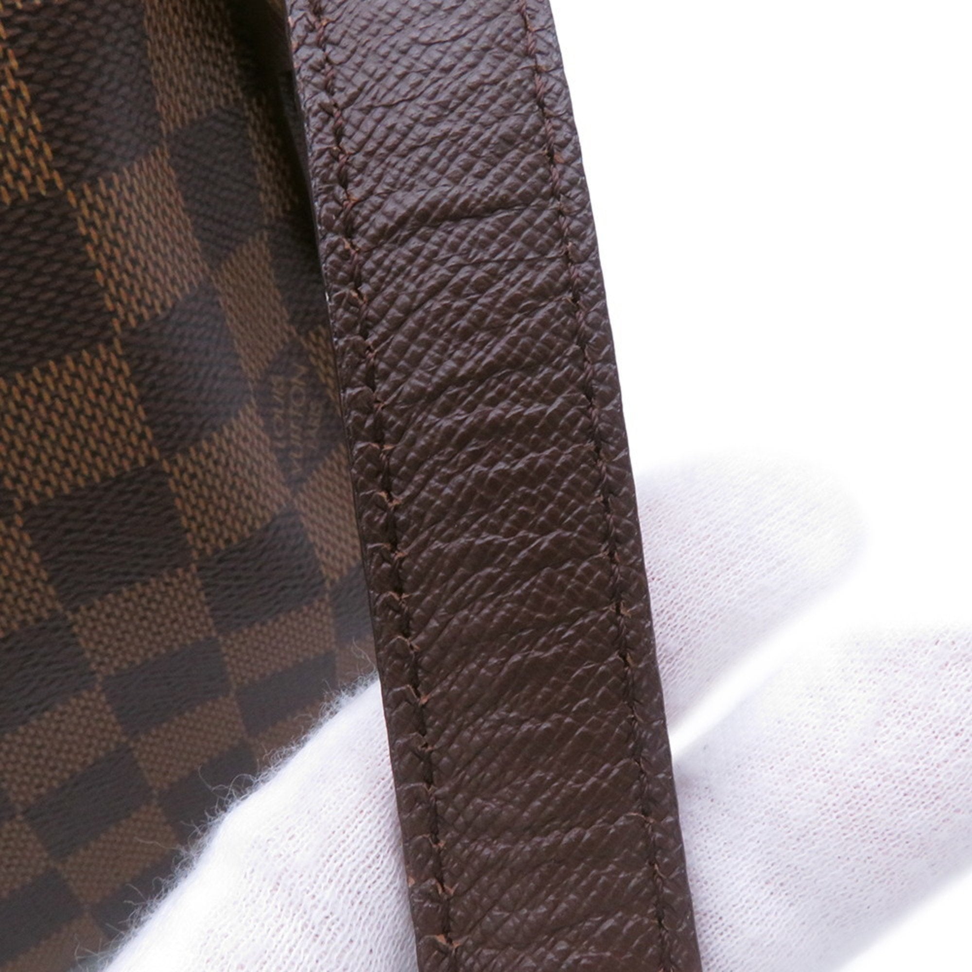 Close-up of the handle of an authentic Louis Vuitton Belem MM bag for sale featuring the signature Damier canvas