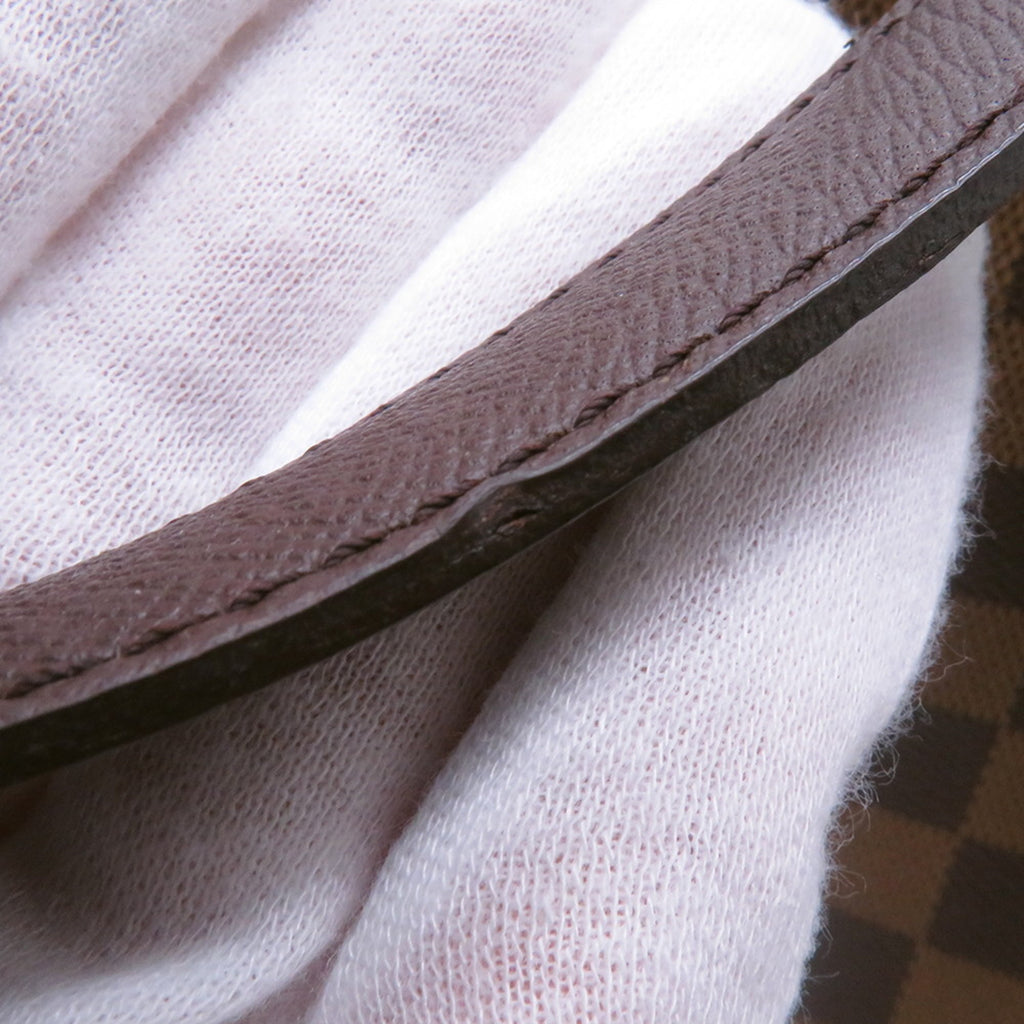 Close-up of the strap of an authentic Louis Vuitton Belem MM bag for sale showing detailed craftsmanship