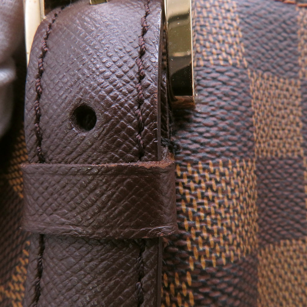 Close-up of the strap and hardware of an authentic Louis Vuitton Belem MM bag for sale