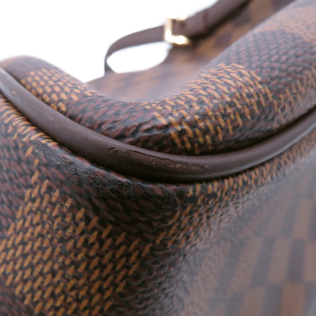 Close-up of authentic Louis Vuitton Belem MM bag for sale showcasing signature Damier canvas detail