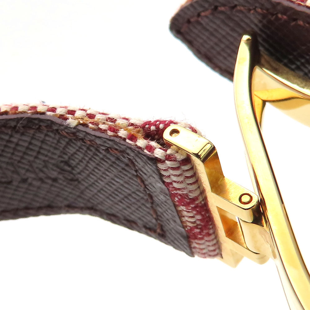 Close-up of authentic secondhand Louis Vuitton jewelry featuring a golden clasp and patterned strap