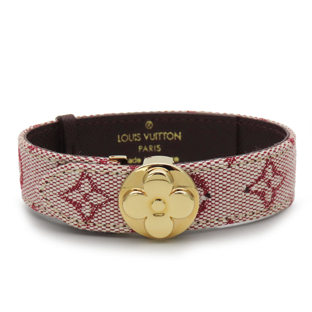 Authentic secondhand Louis Vuitton jewelry bracelet with a gold floral clasp and red monogram pattern