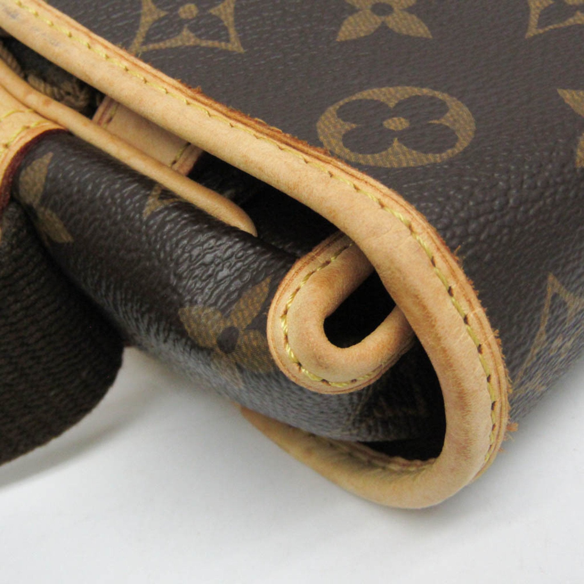 Close-up of LOUIS VUITTON pre-loved Congo PM bag featuring signature monogram Canvas and elegant detailing
