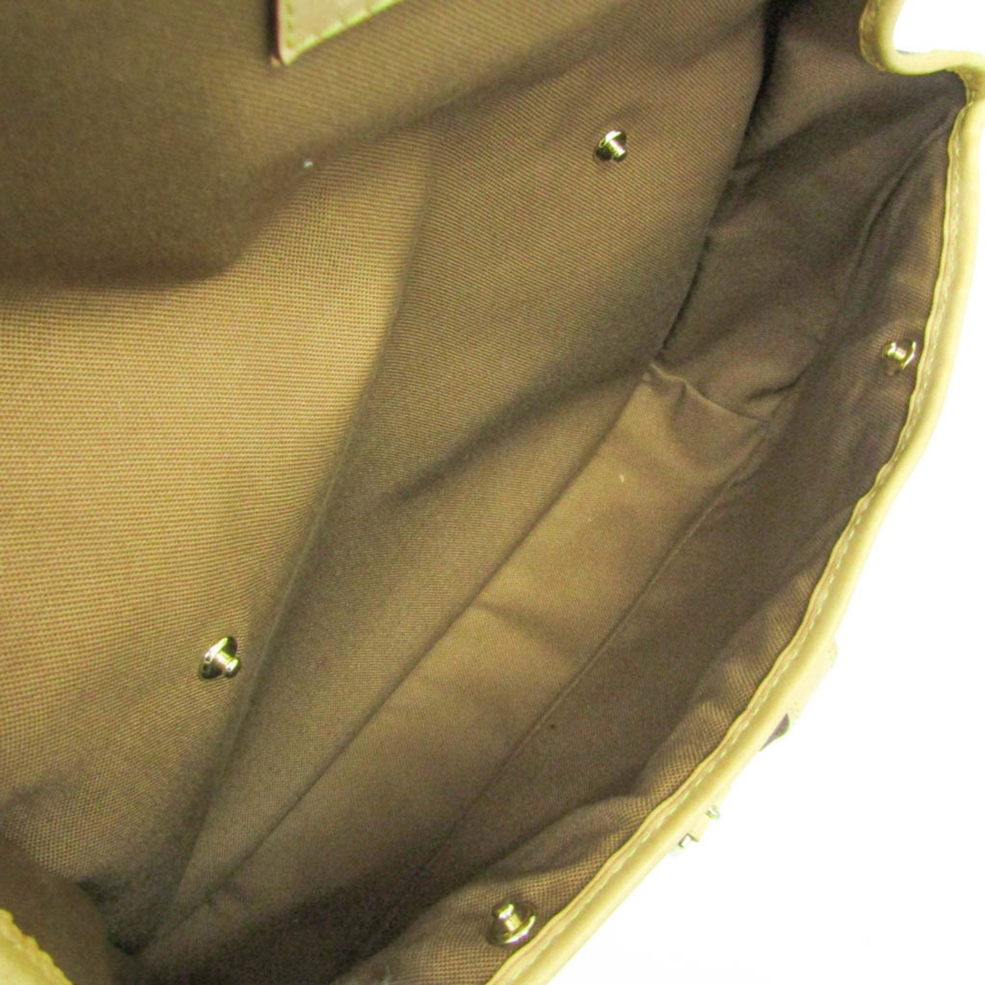 Interior view of LOUIS VUITTON pre-loved Congo PM bag with fabric lining and metal studs