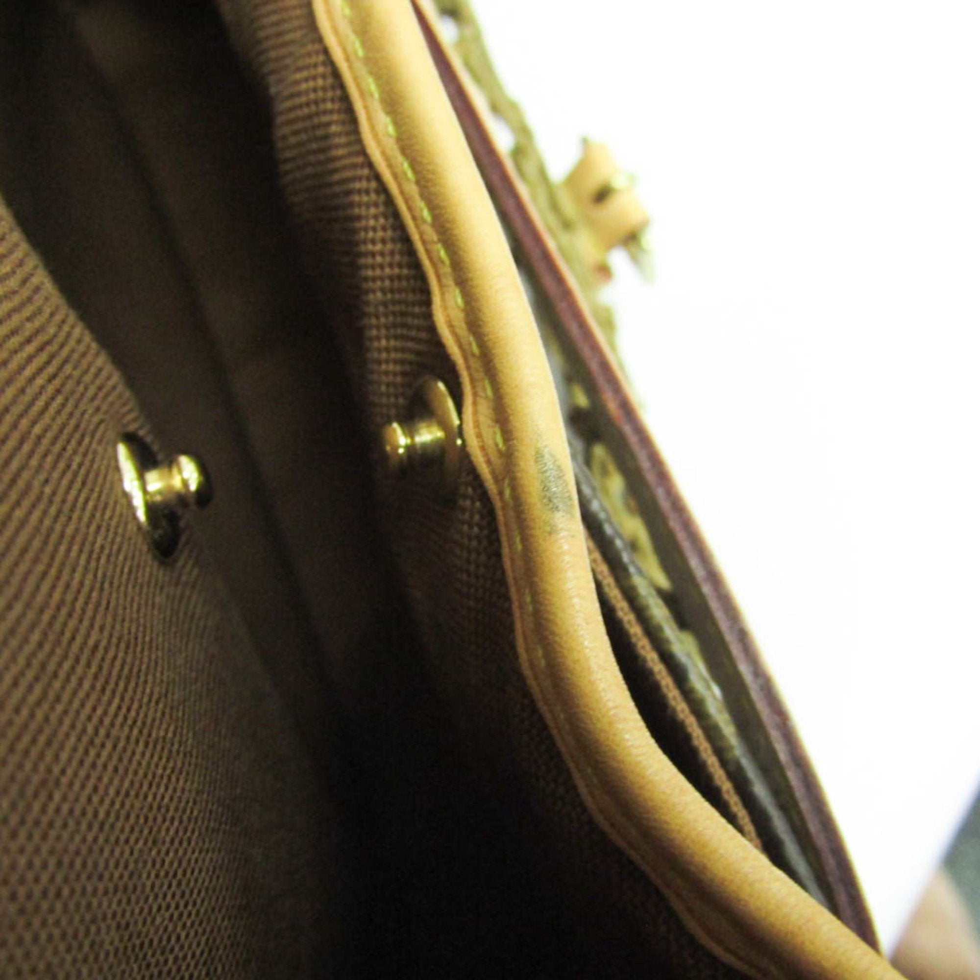 Interior view of a LOUIS VUITTON pre-loved Congo PM bag showcasing its high-quality lining and craftsmanship