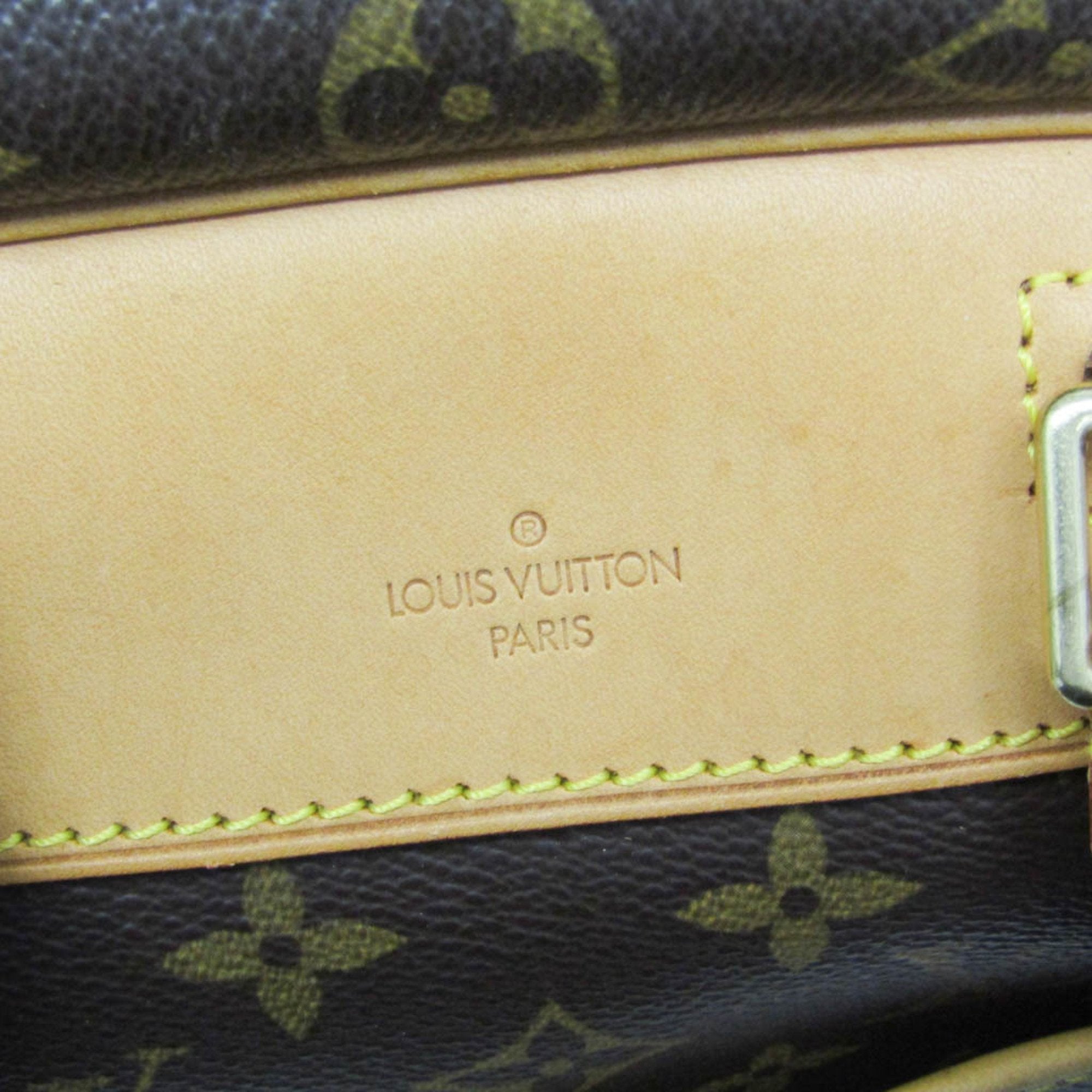 Interior view of LOUIS VUITTON pre loved Deauville bag showing embossed branding and premium material