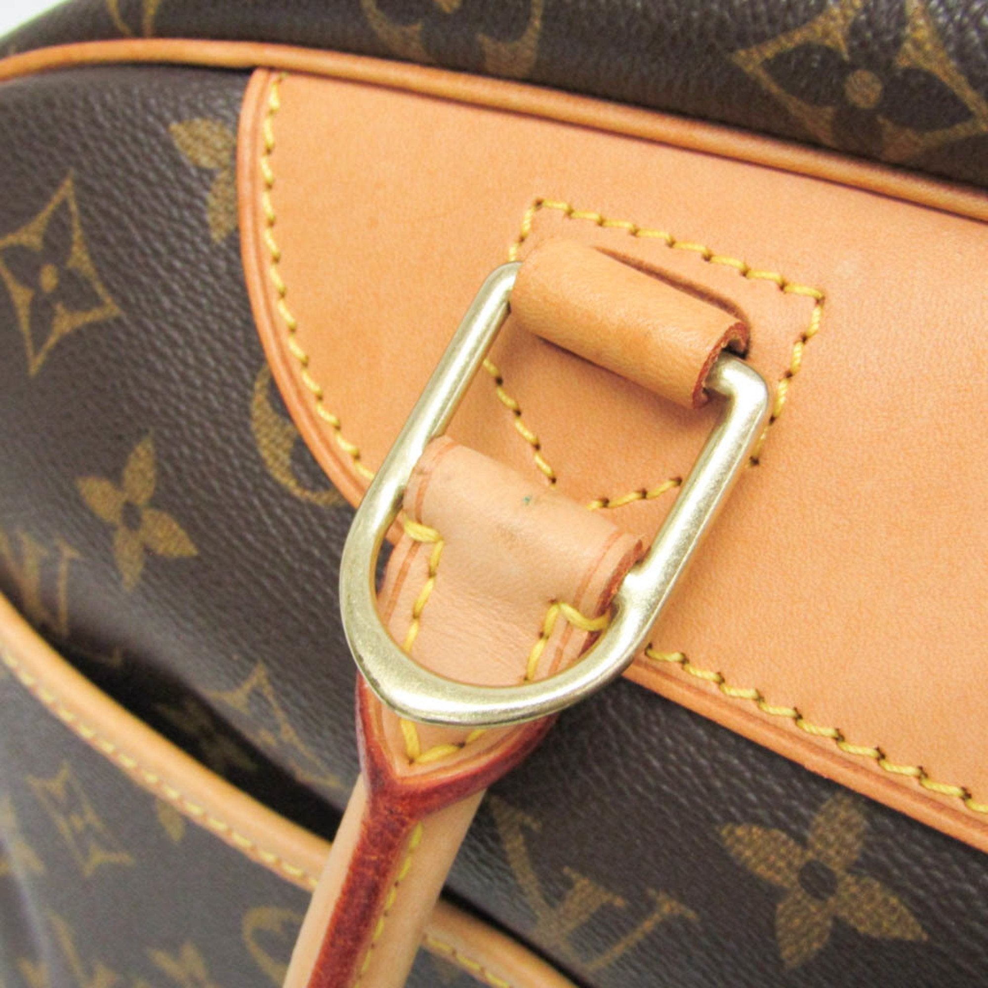 Close-up of LOUIS VUITTON pre loved Deauville bag showing leather strap and signature monogram detail