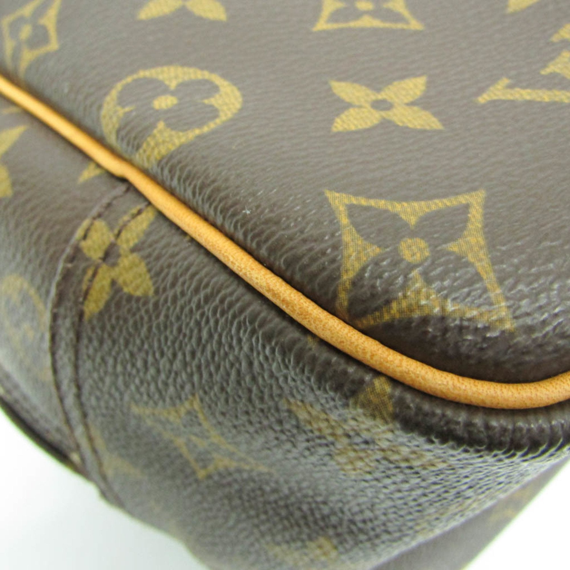 Close-up of LOUIS VUITTON pre loved Deauville bag featuring signature monogram canvas and leather trim
