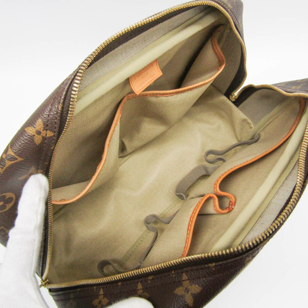Interior view of LOUIS VUITTON pre loved Deauville bag showing spacious pockets and durable lining