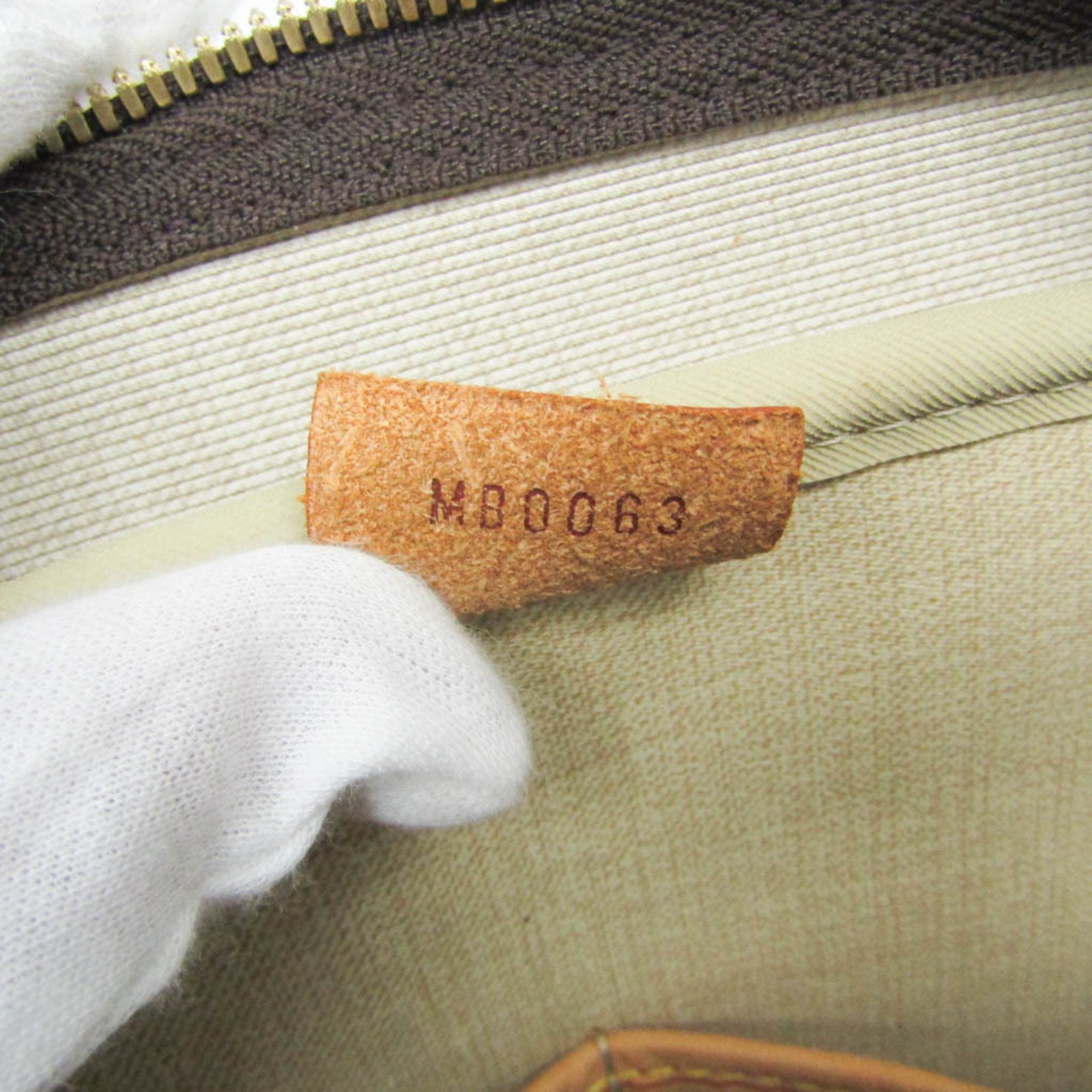 Inside tag of LOUIS VUITTON pre loved Deauville bag showing authenticity code and lining detail
