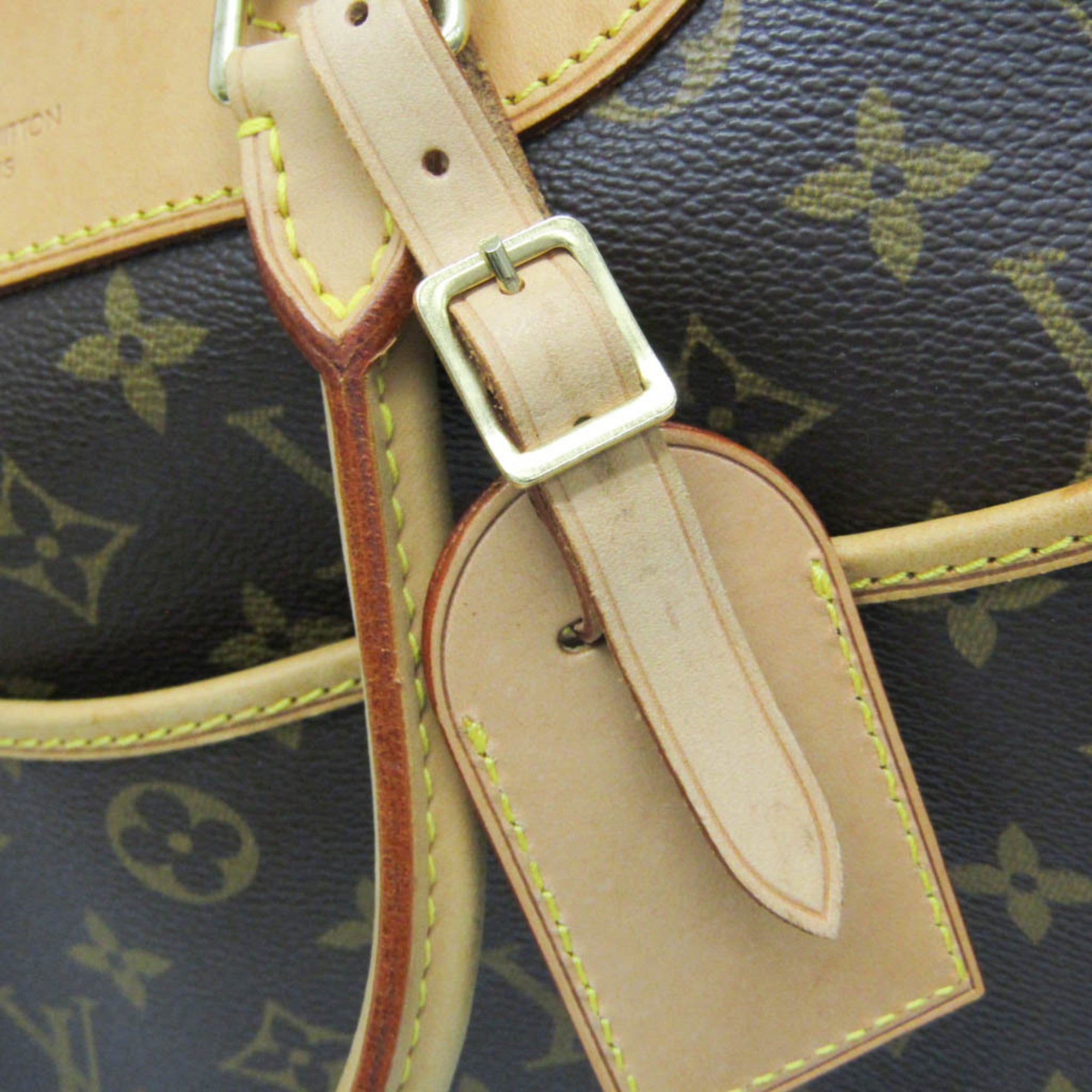 LOUIS VUITTON pre loved Deauville bag detail showing leather strap and signature monogram pattern