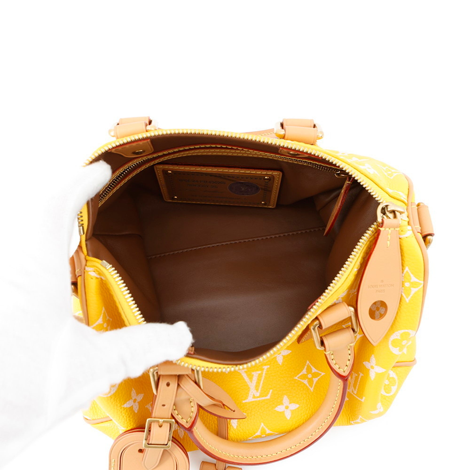 MANSII Pre-loved Louis Vuitton yellow handbag featuring a spacious interior and premium leather accents