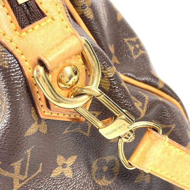 Close-up of a pre-owned Louis Vuitton bag showing the signature monogram and gold hardware detail