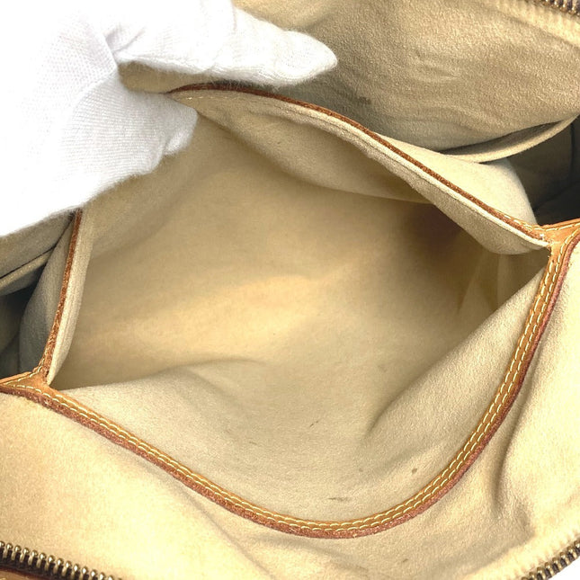 Interior view of a LOUIS VUITTON pre-owned bag showing a spacious lining and zipper closure