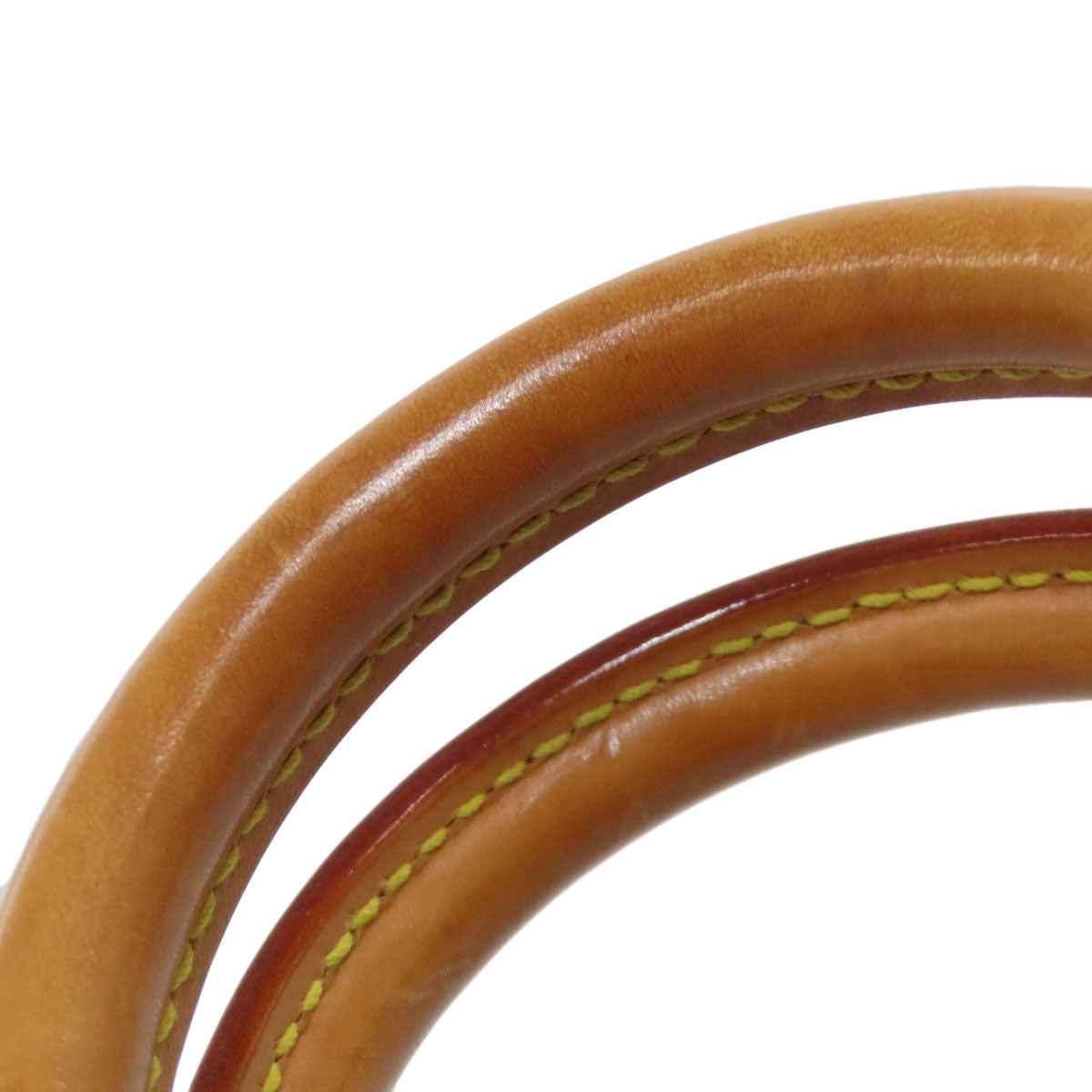 Close-up of pre-owned Louis Vuitton bag handles showcasing luxurious leather craftsmanship
