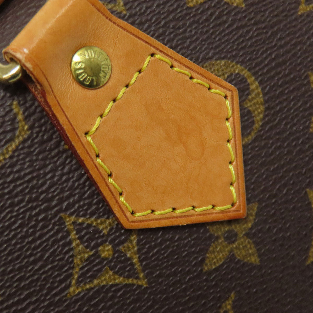 Louis Vuitton pre-owned bag detail showcasing the signature leather tag and stitching