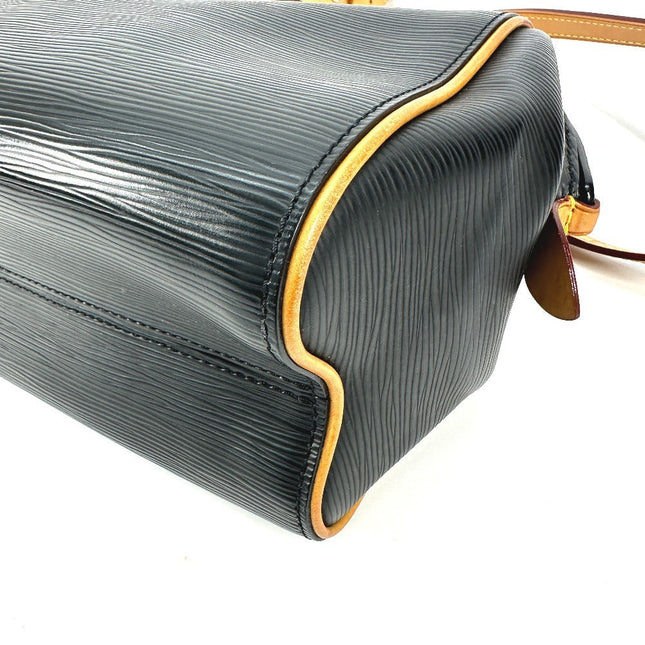 Louis Vuitton pre-owned bag in black with textured finish and gold accents for chic style