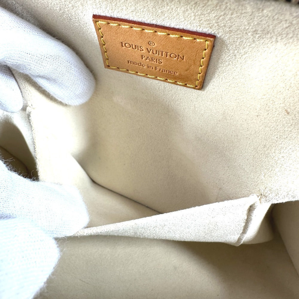 Interior of a pre-owned Louis Vuitton bag showing the brand tag and soft lining