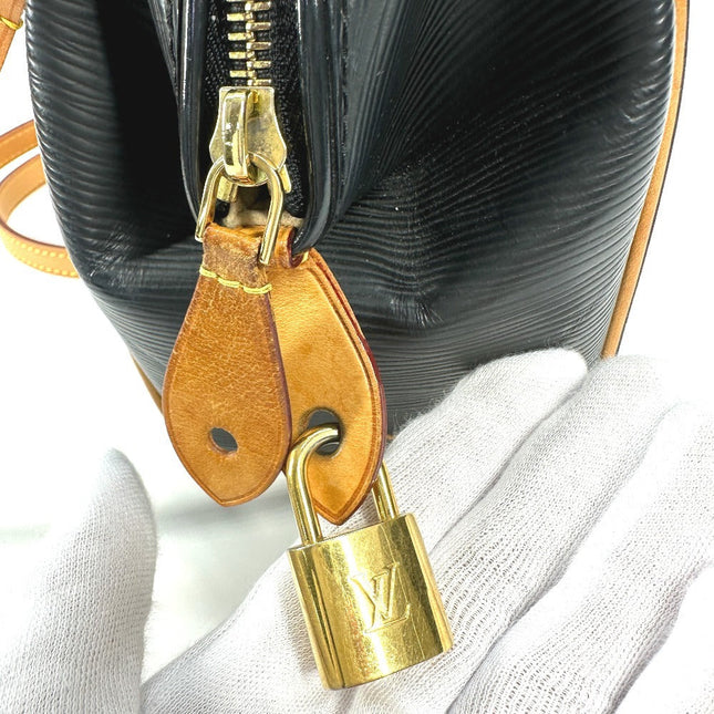 Close-up of a pre-owned Louis Vuitton black Epi leather bag featuring gold hardware and lock detail