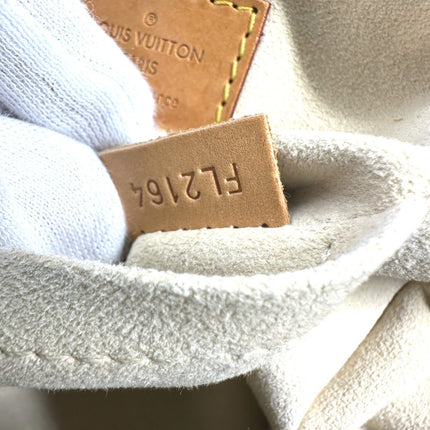 LOUIS VUITTON pre-owned bag interior tag showing authenticity and registration number