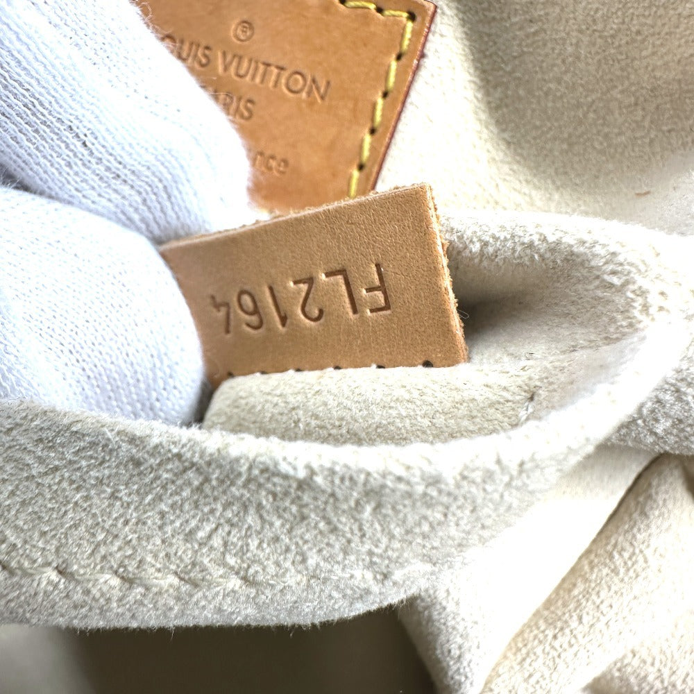 LOUIS VUITTON pre-owned bag interior tag showing authenticity and registration number